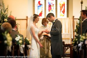 Exchanging rings at the altar.